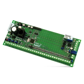The image shows a green electronic circuit board with various components, including resistors, capacitors, and connectors, designed for integration into security systems. The board is labeled "VERSA 15" and features multiple connection points for versatile functionality.