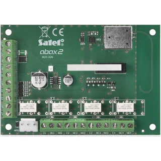 The image shows a green circuit board labeled "Satel abax2 ACX-220," featuring multiple connection terminals and electronic components. It is designed for wireless input expansion in security systems.