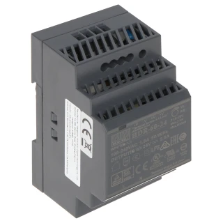 The image shows a compact, gray DIN rail power supply with multiple ventilation slots and a label displaying technical specifications. It is designed for industrial use, providing a reliable power source with an input of 100-240VAC and an output of 12VDC.