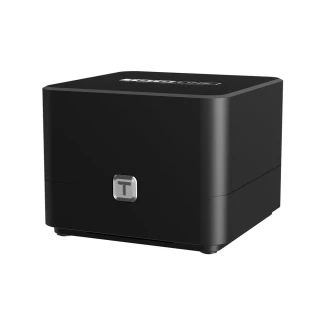 A sleek black Totolink device with a compact, cube-like design and a subtle logo on the top surface. The front features a small, metallic emblem, adding a touch of elegance to its modern appearance.