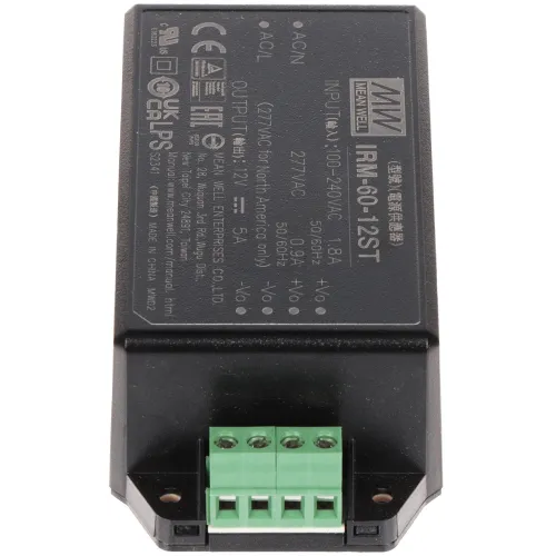 A black Mean Well power supply unit with a green terminal block for electrical connections. The unit features specifications and certification markings printed on its surface.