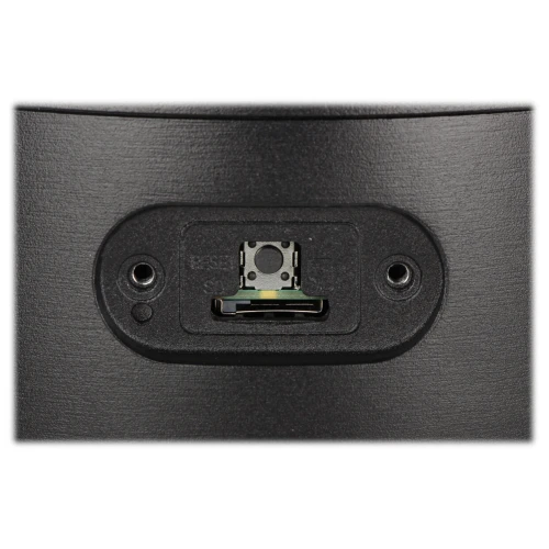 The image shows a close-up of a black electronic device with a central connector port and two screw holes on either side. The textured surface and precise design suggest it is part of a mounting or connection system for electronic equipment.