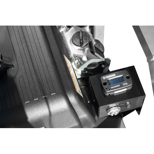 Close-up view of a black generator featuring a Yamaha tachometer and a sturdy engine casing. The image highlights the generator's robust construction and precise instrumentation.