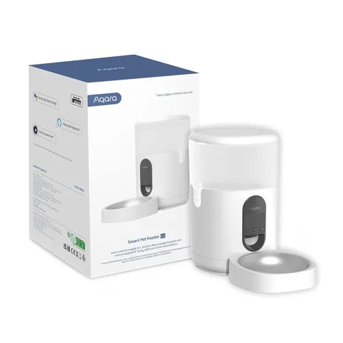 The image shows an Aqara Smart Pet Feeder, featuring a sleek white design with a digital control panel on the front. The product is displayed alongside its packaging, highlighting its modern and functional appearance.
