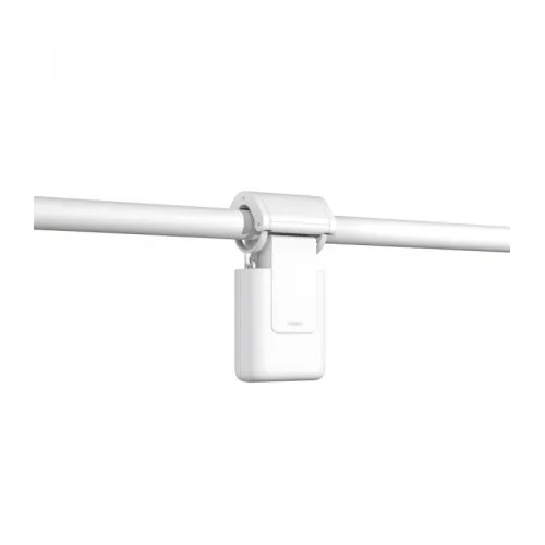 A sleek, white smart curtain motor is attached to a curtain rod, designed for automated curtain control. The compact device features a minimalist design, blending seamlessly with modern home decor.