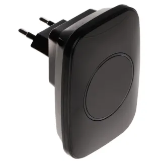 A sleek, black wireless door chime with a minimalist design, featuring a circular button in the center. The device is designed to plug directly into a standard AC 230V outlet.