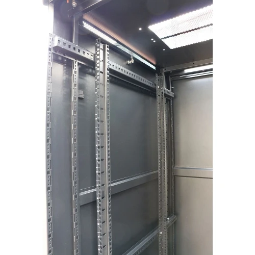 The image shows the interior of a black server rack cabinet with adjustable vertical rails for mounting equipment. The cabinet features a perforated top panel for ventilation and cable management.