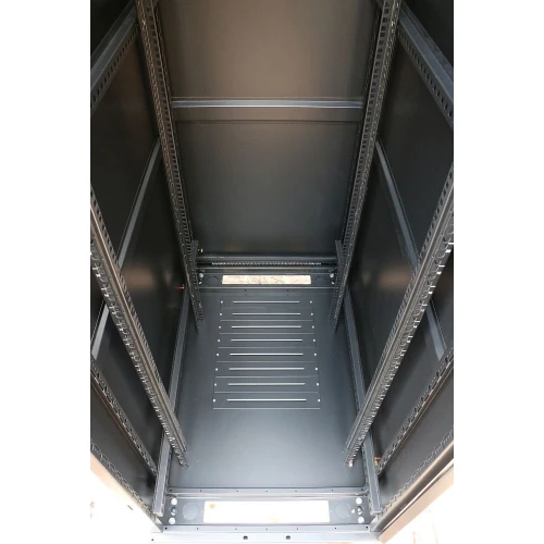 The image shows a spacious, empty server rack cabinet with a sturdy metal frame and adjustable mounting rails. The interior is designed for efficient cable management and optimal airflow, suitable for housing various networking equipment.