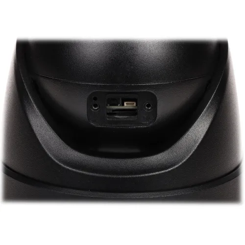 The image shows a close-up of a black device featuring a memory card slot and a reset button. The design is sleek and modern, emphasizing functionality and ease of access.