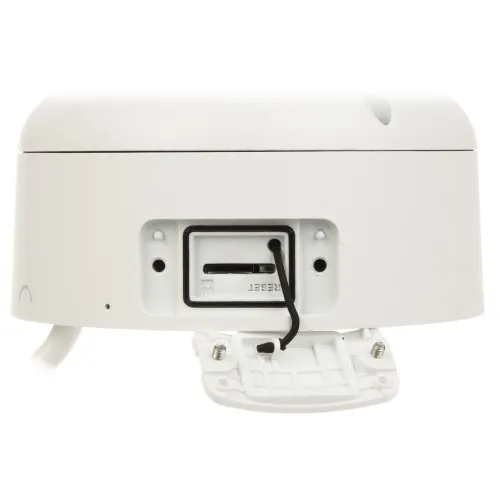 The image shows a white electronic device featuring a memory card slot and a reset button, designed for easy access and functionality. The device has a sleek, rounded exterior with a small cable connected to the reset button area.
