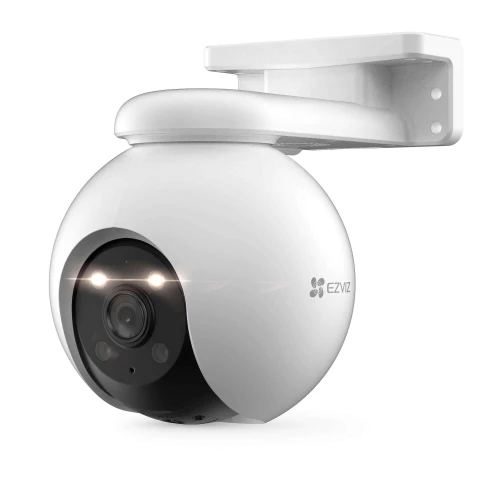 A sleek, white security camera with a spherical design and dual LED lights is mounted on a wall bracket. The camera features a prominent lens and the EZVIZ logo on its side.
