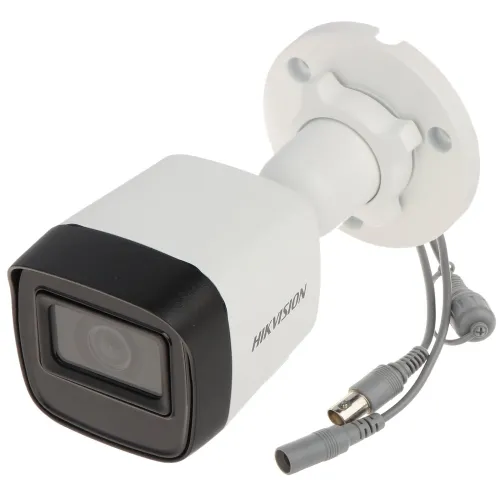 The image shows a Hikvision security camera with a sleek white and black design, featuring a cylindrical body and a mounting bracket for easy installation. The camera includes multiple connectors for power and video output, emphasizing its functionality and versatility in surveillance setups.