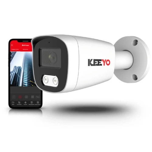A sleek, white bullet security camera with a black faceplate is shown alongside a smartphone displaying a surveillance app interface. The camera features dual LED lights and the brand logo "KEEYO" on its side.