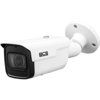 A sleek, white security camera with a modern design and a prominent lens is mounted on an adjustable bracket. The camera features the BCS logo on its side, indicating its brand.