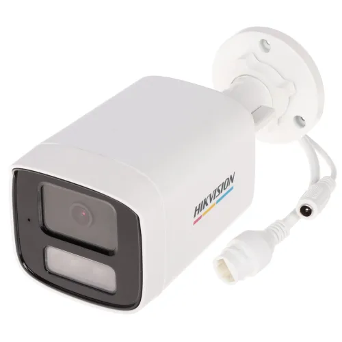 A white Hikvision IP camera with a sleek, rectangular design features a prominent lens and LED light on the front. The camera is equipped with a mounting bracket and connection cables for easy installation.