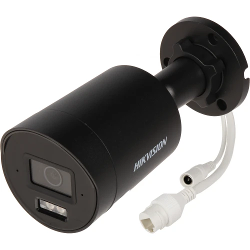 The image shows a black Hikvision IP camera with a cylindrical design and a mounting bracket. It features a lens and LED light on the front, along with a white cable for connectivity.