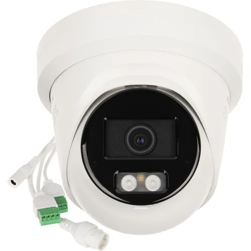 A white dome-shaped Hikvision IP camera with a prominent lens and two LED lights is shown, featuring multiple connection cables. The camera is designed for security purposes, offering advanced motion detection and high-resolution video capture.