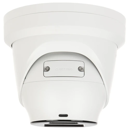 A white, dome-shaped IP security camera with a sleek design and visible mounting screws. The camera features a setting adjustment panel on its side for easy configuration.