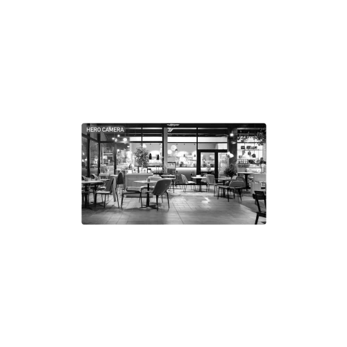 A black and white image of a modern, stylish café interior with empty tables and chairs, featuring large windows and ambient lighting. The text "HERO CAMERA" is displayed in the upper left corner, suggesting a focus on surveillance or security.