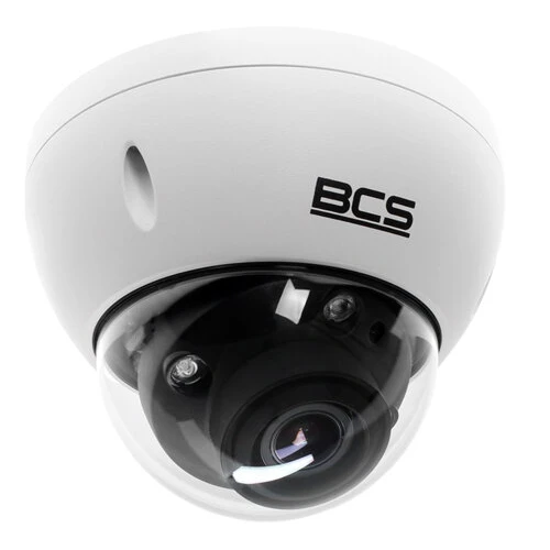 A white dome-shaped IP security camera with a clear protective cover and visible lens. The camera features the BCS logo on its exterior, designed for indoor or outdoor surveillance.