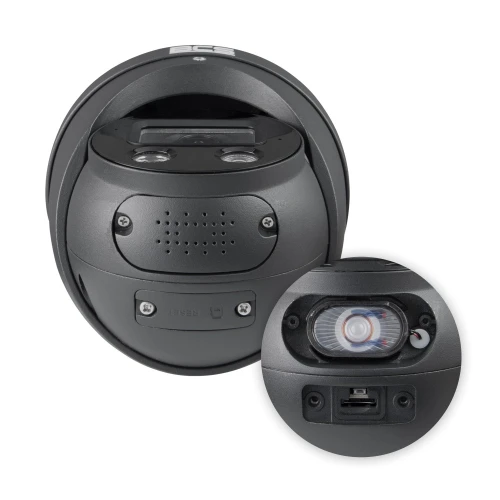 A black dome IP camera with a compact design features multiple lenses and infrared sensors for enhanced security monitoring. The close-up inset highlights the camera's connectivity ports and detailed sensor layout.