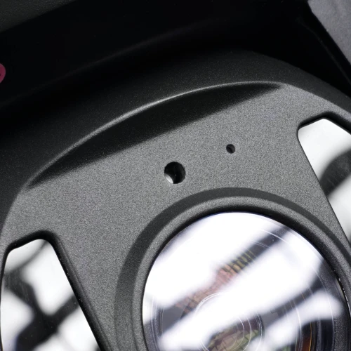 The image shows a close-up of a sleek, black IP camera with a prominent lens and two small indicator lights above it. The camera's design features a modern, durable casing suitable for various surveillance needs.