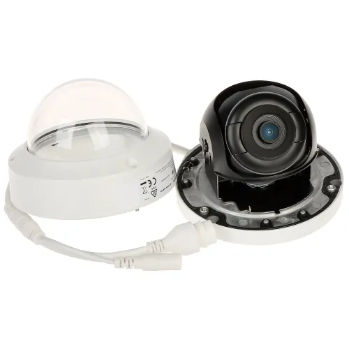 A dome security camera with its cover removed, revealing the internal lens and wiring. The camera features a white base and a clear dome cover, designed for discreet surveillance.