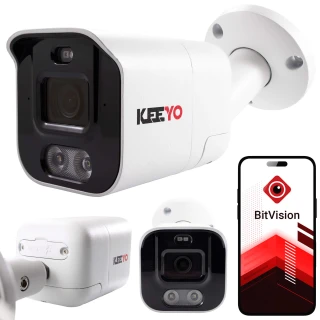 A white, bullet-style IP camera with the brand name "KEEYO" prominently displayed, featuring a sleek design and advanced lens technology. The image also shows a smartphone screen with the BitVision app, indicating compatibility for remote monitoring.
