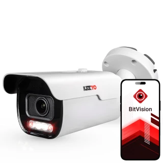 The image shows a sleek, white Keeyo IP bullet camera with a protective hood and visible lens, designed for outdoor surveillance. Next to the camera is a smartphone displaying the BitVision app interface, indicating remote monitoring capabilities.