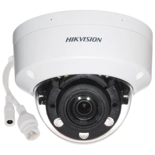 A white, dome-shaped Hikvision security camera with a prominent lens and multiple LED lights for enhanced visibility. The camera features a durable, vandal-resistant design and includes connection cables for easy installation.