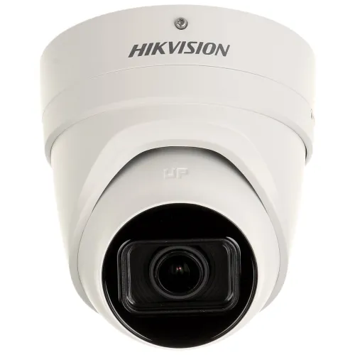 The image shows a white, vandal-resistant IP camera with a sleek dome design and motorized zoom lens. It features the Hikvision logo prominently on the top, indicating its brand.