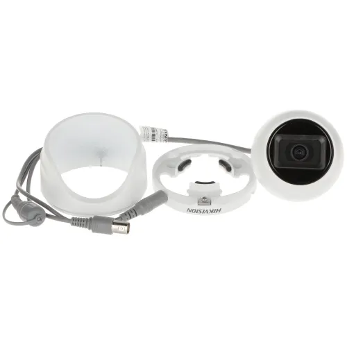The image shows a disassembled security camera with a white mounting bracket and connecting cables. The camera lens is prominently displayed, highlighting its compact design and sleek finish.