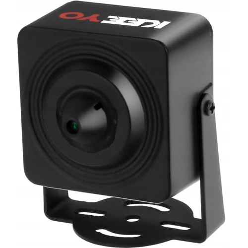 A compact black mini pinhole camera with a square design and a small lens in the center, mounted on an adjustable bracket. The brand name is printed in white and red on the top surface of the camera.