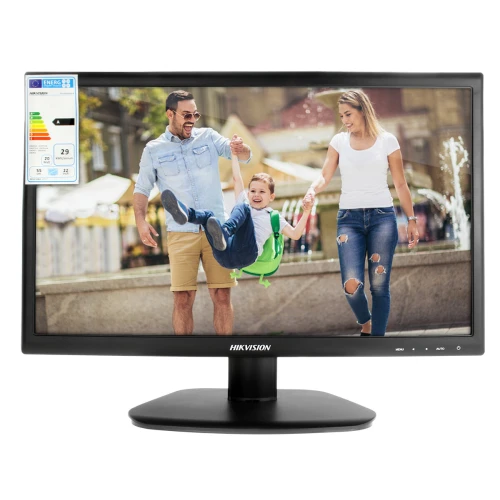 The image shows a Hikvision LED monitor with a sleek black frame and a sturdy base, displaying a vibrant family scene. An energy efficiency label is visible on the top left corner of the screen.