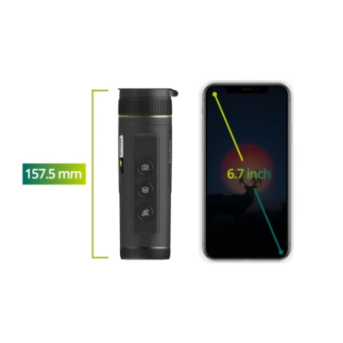 A black thermal monocular with a textured grip and three control buttons is shown next to a smartphone for size comparison. The monocular measures 157.5 mm in length, while the smartphone screen is 6.7 inches diagonally.