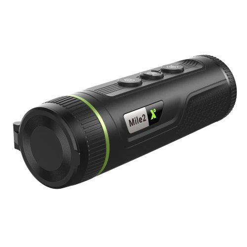 A sleek black thermal monocular with a textured grip and three control buttons on top, featuring a green accent ring near the lens. The device is compact and portable, designed for enhanced visibility in low-light conditions.