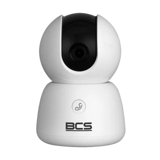 A sleek, white indoor security camera with a rotating lens designed for comprehensive surveillance. The camera features a modern, compact design with the BCS logo prominently displayed on the front.