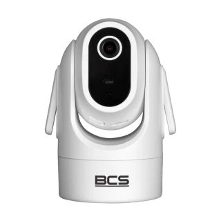 A sleek, white indoor security camera with a rotating design and a prominent lens at the center. The camera features the BCS logo on its base, emphasizing its brand identity.