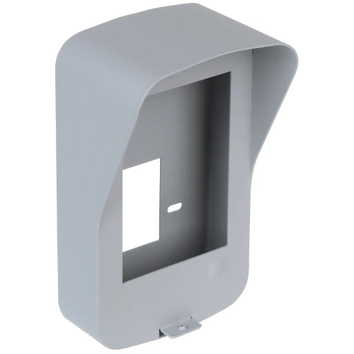 The image shows a sleek, gray surface-mounted housing designed for security devices. It features a rectangular opening and a protective hood to shield against environmental elements.