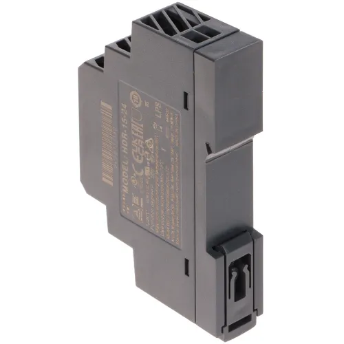The image shows a compact, dark gray electrical module designed for DIN rail mounting, featuring a secure clip mechanism at the bottom. The module has detailed specifications printed on its side, indicating its compliance with various standards.