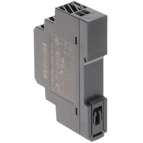 The image shows a compact, dark gray DIN rail power supply with a sturdy plastic casing and clear labeling on the side. It features a clip for easy mounting on a DIN rail, designed for efficient integration into electrical systems.