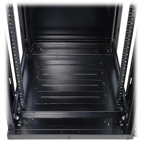 A black floor cable grommet is integrated into a server rack, providing an organized solution for cable management. The grommet features a sleek design that blends seamlessly with the rack's structure.