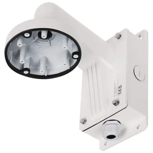 The image shows a white, wall-mounted camera bracket designed for outdoor use, featuring a sturdy construction with a circular base and multiple mounting points. The bracket includes a protective cover and a cable entry point for secure installation.