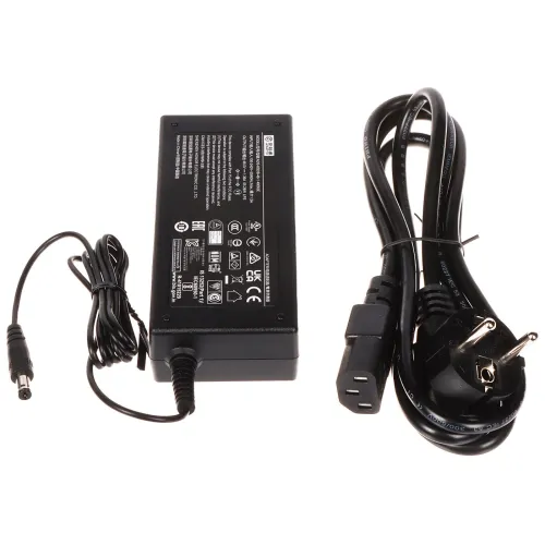 A black power adapter with a connected cable is shown alongside a detachable power cord with a three-prong plug. The adapter features various certification symbols and specifications printed on its surface.