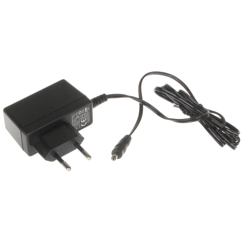 A black AC power adapter with a European plug and a long, coiled cable ending in a cylindrical connector. The adapter features a label with technical specifications and safety certifications.