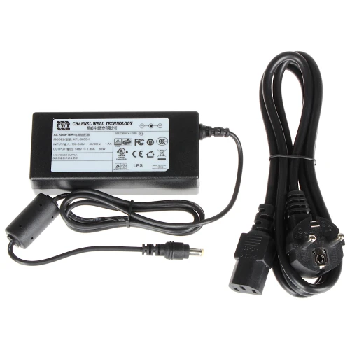 A black AC adapter with a power cord and plug, featuring multiple certification symbols and specifications on its label. The adapter is designed for electronic devices, providing a reliable power supply with a standard connector.