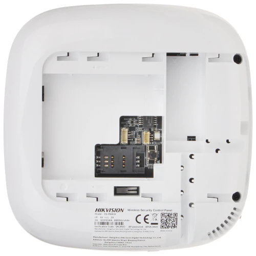 The image shows the underside of a white wireless security control panel with an open cover, revealing internal components and connection ports. The design is sleek and compact, suitable for discreet installation in various settings.