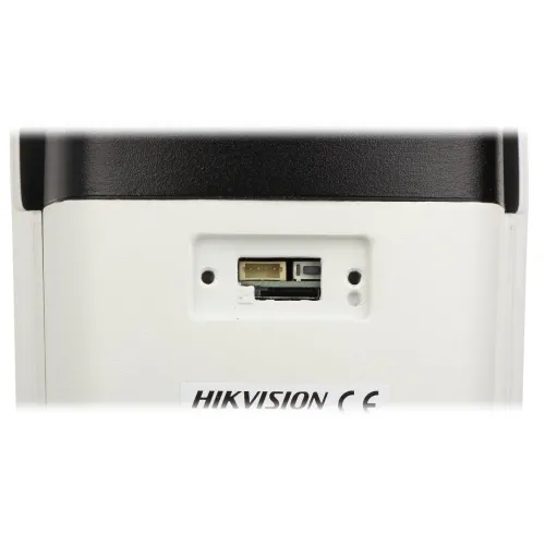 The image shows the bottom view of a Hikvision security camera, highlighting its connection ports. The camera features a white casing with a black top section and visible CE marking.
