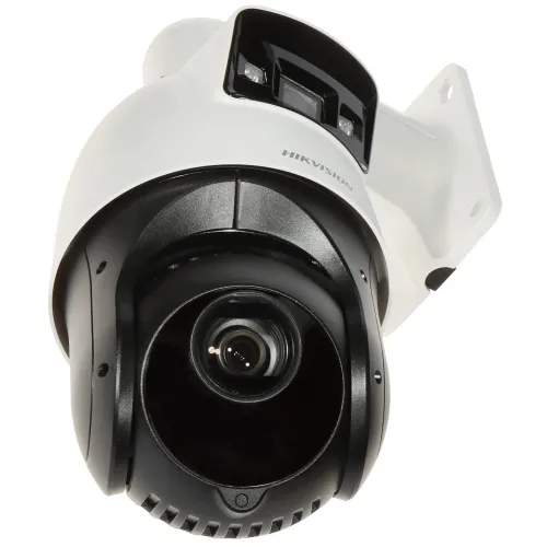 A white and black security camera with a dome-shaped lens is mounted on a bracket, designed for outdoor surveillance. The camera features a sleek, modern design with visible infrared sensors for night vision capabilities.