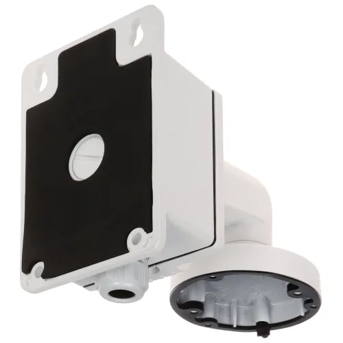 Wall-mounted white security camera bracket with a rectangular base and circular attachment point. The design includes a protective cover and multiple screw holes for secure installation.